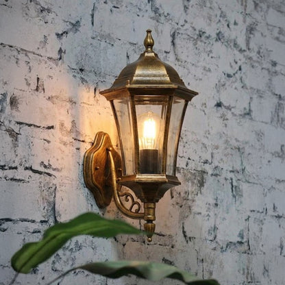 Traditional outdoor wall light installed on stone wall creating warm ambient entrance lighting for classic home exteriors.