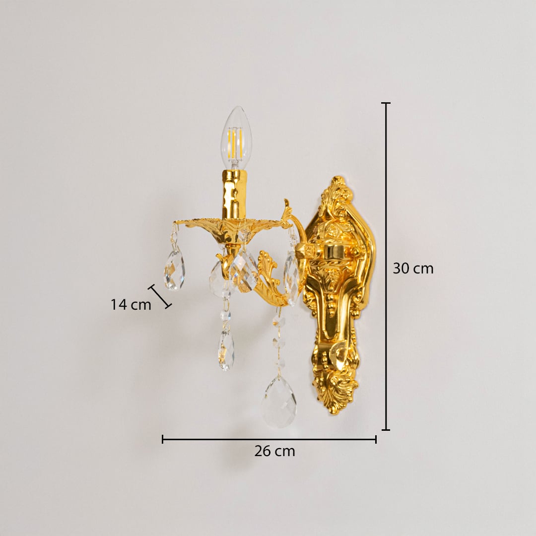 Golden wall light with crystal drops dimensions 30cm height 26cm width 14cm depth displayed on white background.