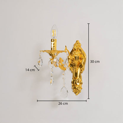 Golden wall light with crystal drops dimensions 30cm height 26cm width 14cm depth displayed on white background.