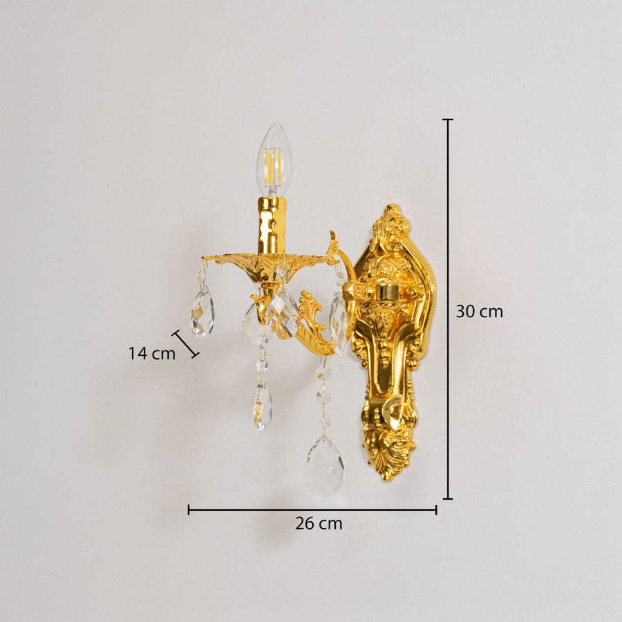 Golden wall light with crystal drops dimensions 30cm height 26cm width 14cm depth displayed on white background.