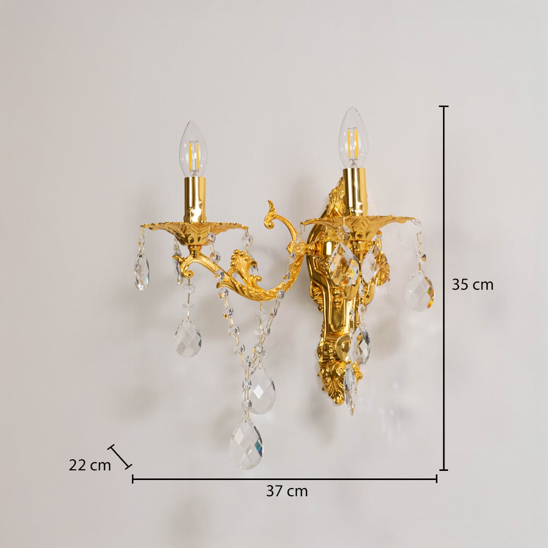Golden wall light with crystal drops size 35cm height 37cm width 22cm depth displayed with measurements on background.