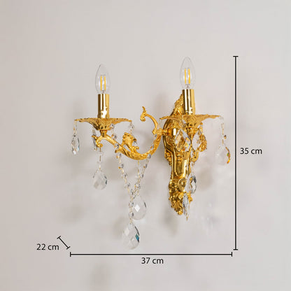 Golden wall light with crystal drops size 35cm height 37cm width 22cm depth displayed with measurements on background.