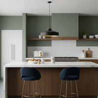 Black metal pendant light above kitchen island adding contemporary elegance and warm ambient illumination.