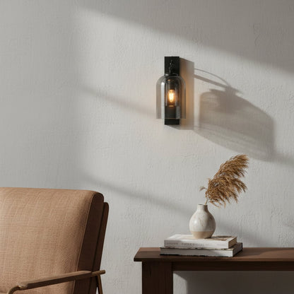 Modern black metal wall light enhancing cozy bedroom corner with warm ambient interior lighting decor.