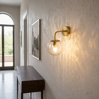 Elegant brass wall light with textured glass glow enhancing modern hallway and bedroom interior ambiance.