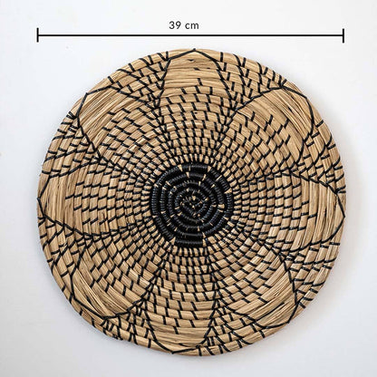 Natural handwoven seagrass basket wall decor with black flower pattern and dimension measurement for bohemian home styling.