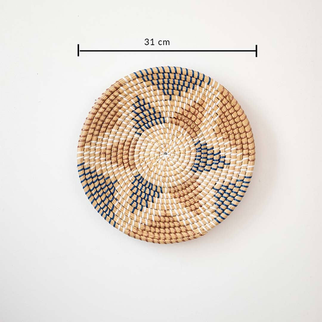 Aztec star geometric patterned black and beige woven seagrass wall hanging basket plate featuring a size line indicator.