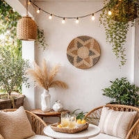 Natural woven wall basket styled above a sofa creating a warm bohemian wall decor for modern living spaces.