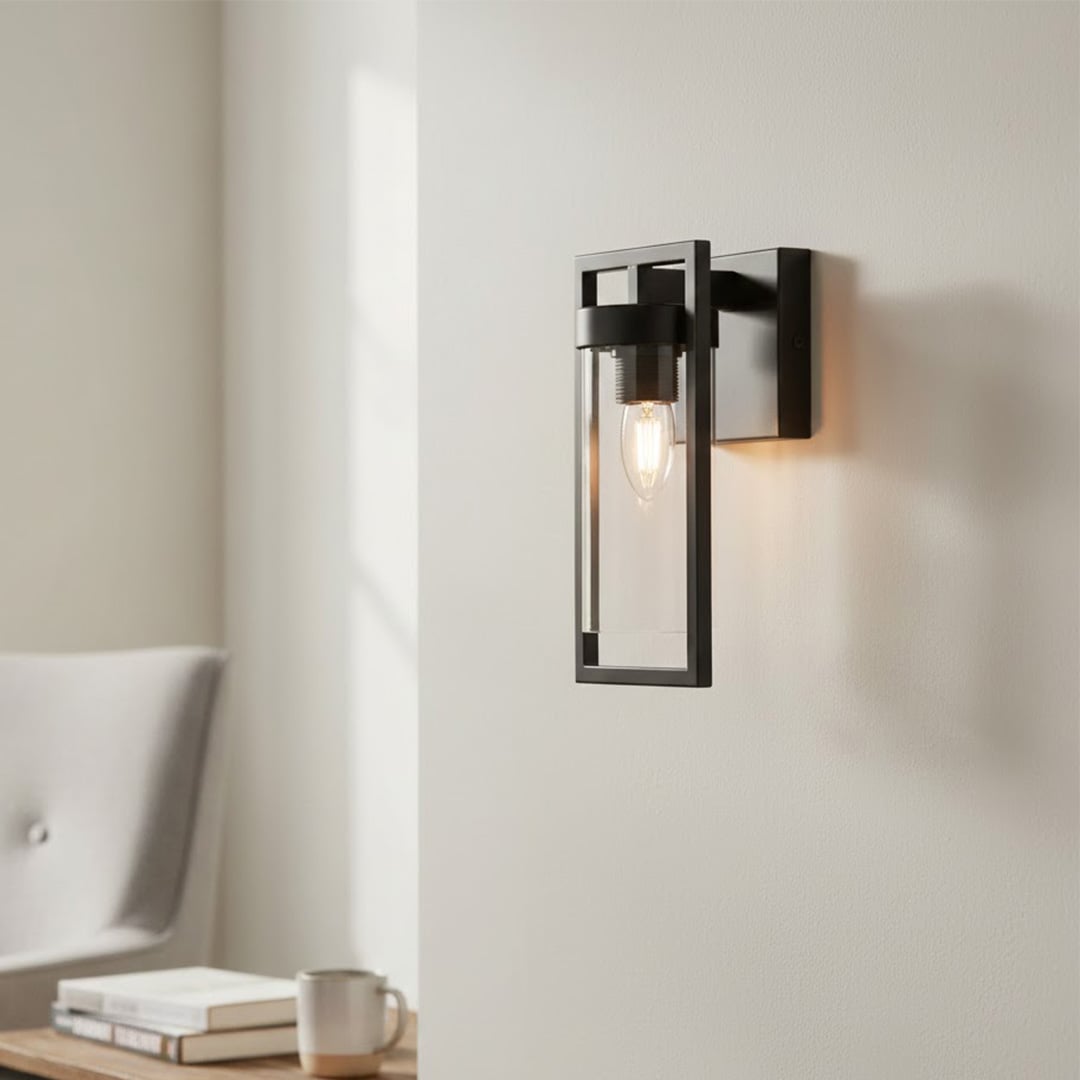 Modern black metal wall light with warm glow for stylish hallway and contemporary home decor spaces.