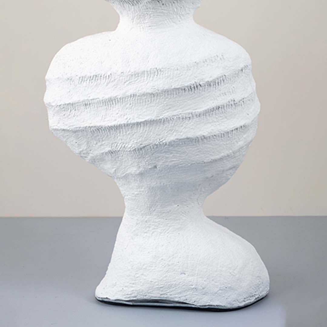 White ceramic decorative vase with layered sculptural texture for artistic shelf styling and modern home decor displays.