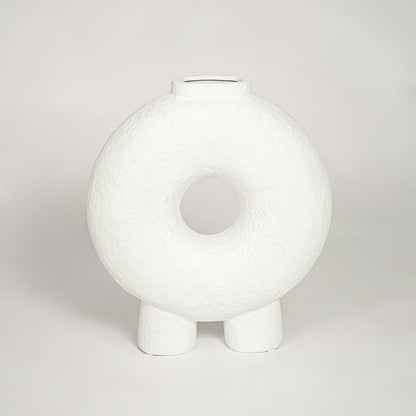 Contemporary white ceramic decorative vase with circular cutout perfect for entryway table living room or dining decor display.