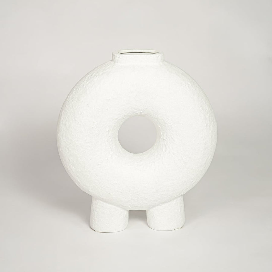 Contemporary white ceramic decorative vase with circular cutout perfect for entryway table living room or dining decor display.