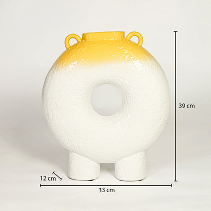 White and yellow ceramic decorative ring vase showing 39 cm height 33 cm width and 12 cm depth suitable for table console or shelf placement.