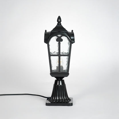 Vintage black outdoor gate light with textured glass panels for elegant exterior decor use.