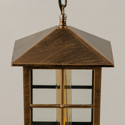 Close up view of the decorative metal rings and inner glass globe of the black spherical cage pendant light fixture.