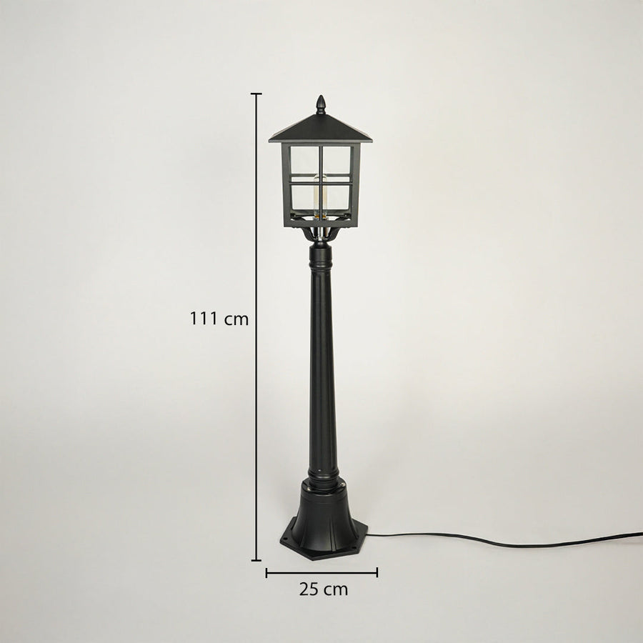 Classic outdoor garden lamp post with black metal body and glass lantern head on neutral background 111 cm height 25 cm base width perfect for pathway lighting.