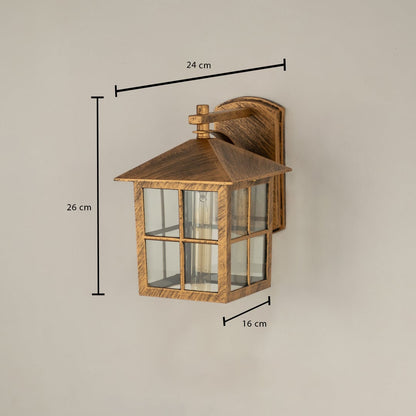 Gold metal outdoor lantern with window pane glass shown with 26 cm height 24 cm width and 16 cm depth offering clear sizing for outdoor installation.