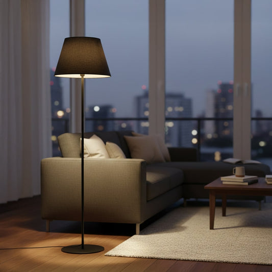 Modern black metal floor lamp with dark grey fabric shade styled in contemporary living room corner decor.