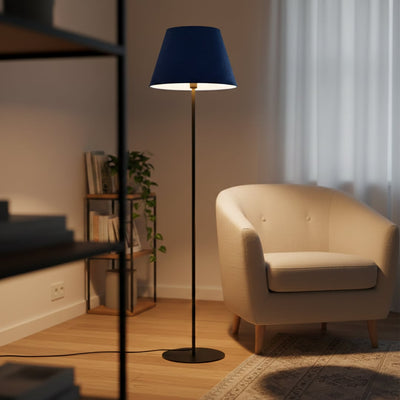 Modern black metal floor lamp with blue fabric tapered shade styled in contemporary living room corner decor setting.