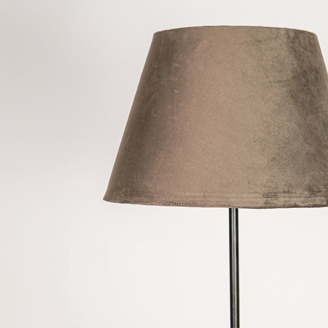 Closeup dark grey fabric drum shade with smooth texture for soft diffused lighting in modern interior spaces Decor.