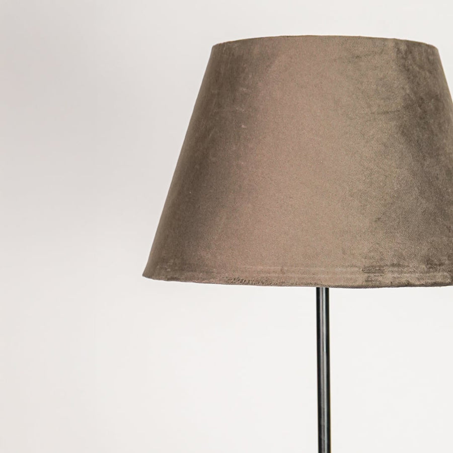 Closeup dark grey fabric drum shade with smooth texture for soft diffused lighting in modern interior spaces Decor.