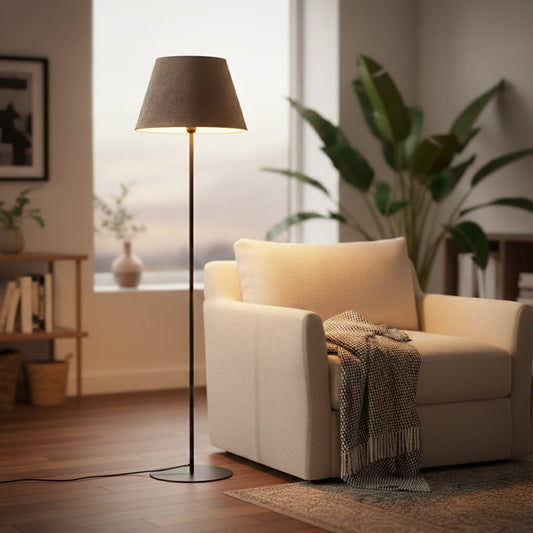 Modern black metal floor lamp with dark grey fabric shade placed in living room corner for warm ambient lighting Decor.