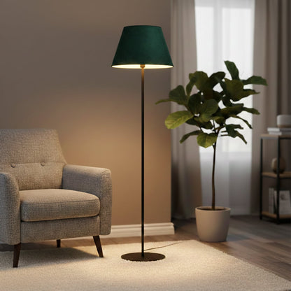 Modern black metal floor lamp with green velvet tapered shade styled in elegant living room corner decor setting.