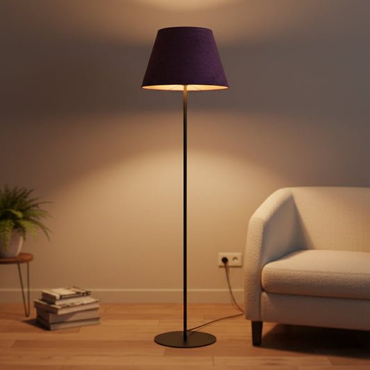 Modern black metal floor lamp with rich purple fabric shade styled in contemporary living room interior setting.
