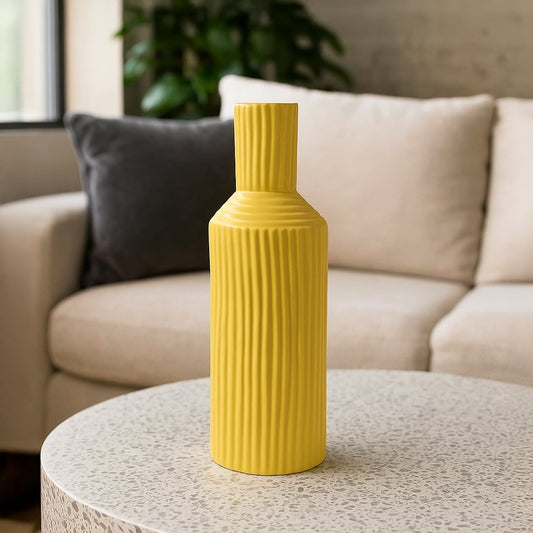 Yellow ribbed ceramic vase styled in a bright modern interior perfect for shelves tables and vibrant contemporary home decor accents.