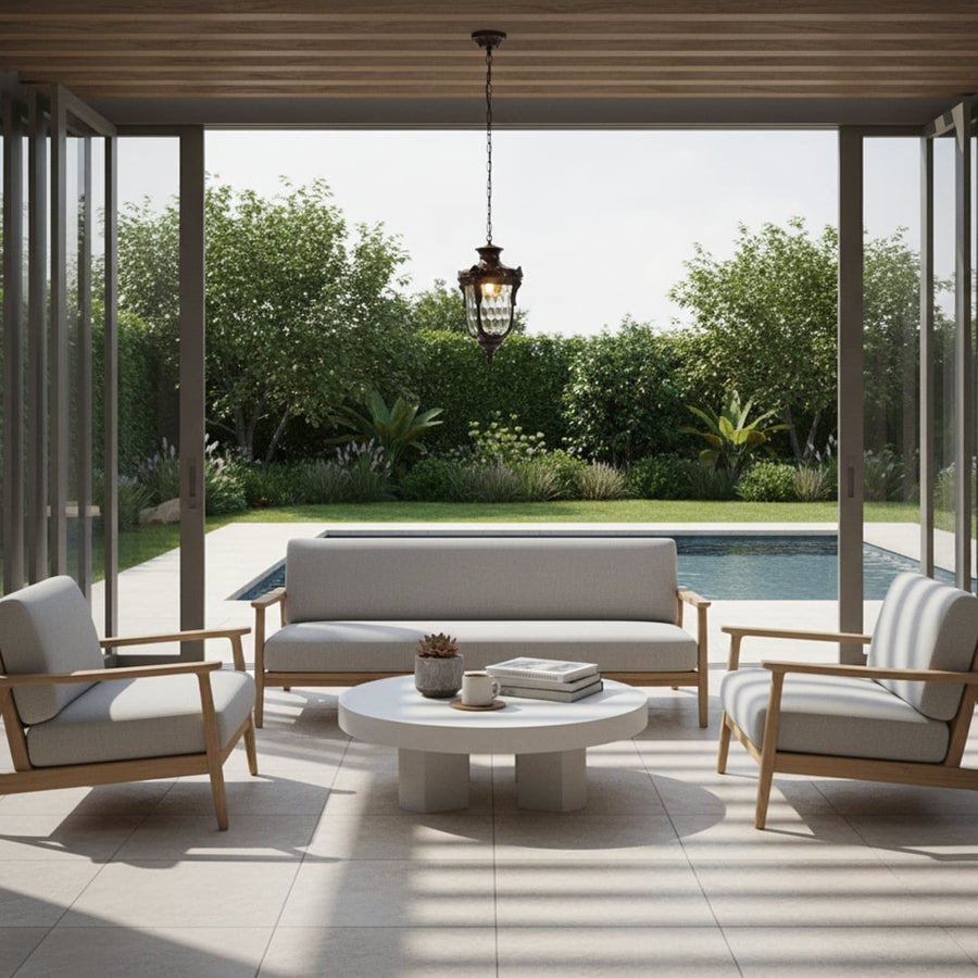 Vintage brass hanging lantern light elevating modern outdoor patio seating area with warm ambient lighting.