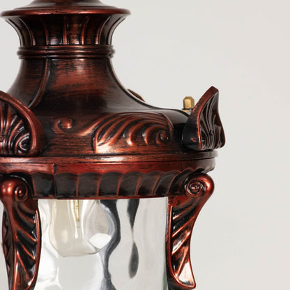 Traditional hanging lantern light glowing warmly on white background showing detailed frame and clear glass.
