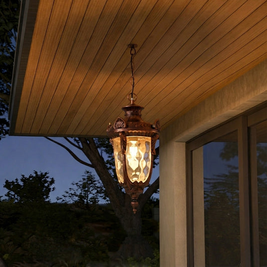 Antique hanging outdoor lantern with warm glowing panels styled on porch ceiling for elegant decor ambiance.