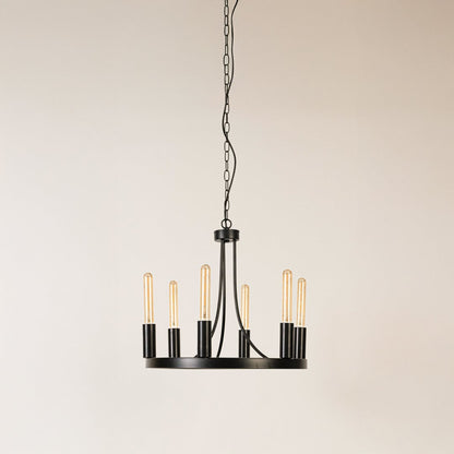 Contemporary black metal six light candelabra chandelier with chain and Edison bulb sockets turned off on white background.