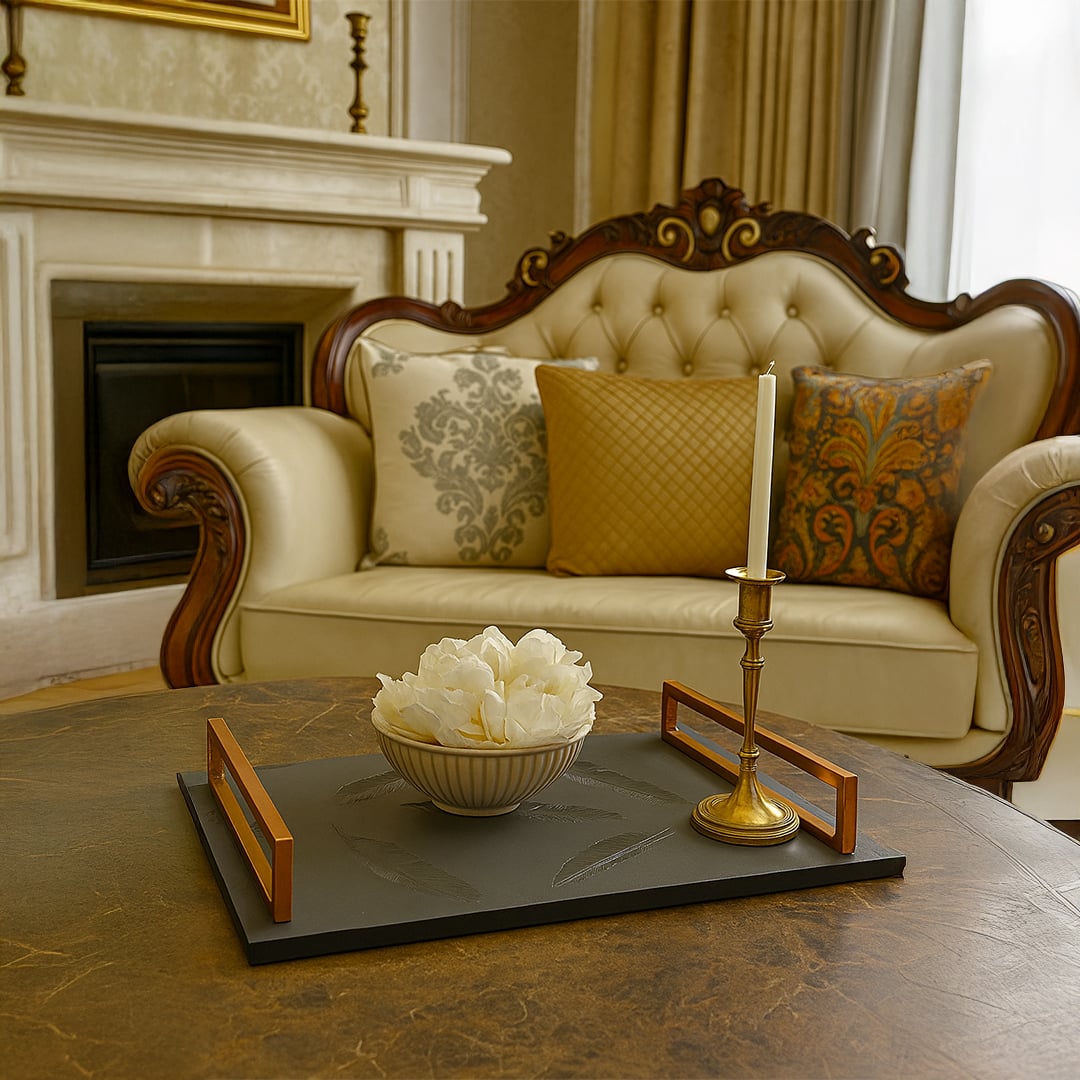 Feather serving tray with grey stone base and gold handles styled on coffee table for elegant living room home decor.