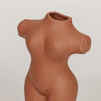 female torso decorative vase brown closeup