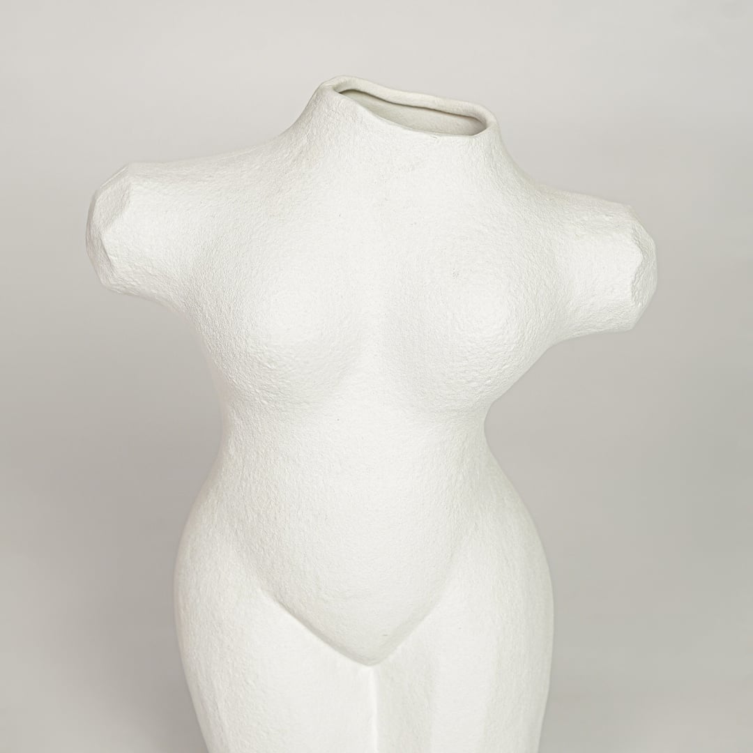 White ceramic female body sculpture vase with textured finish perfect for artistic flower display on console table shelf decor.