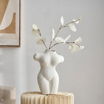 White ceramic female body vase with sculpted artistic form perfect for dried flower display on console table shelf and modern home decor.