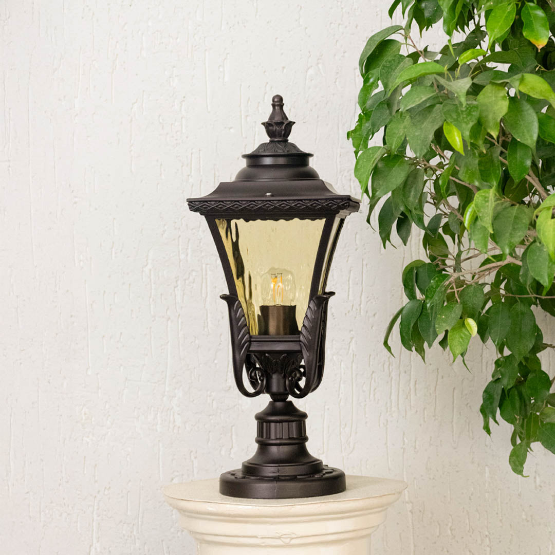 Antique black outdoor gate light with clear glass shade for luxury exterior decor styling use.