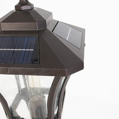 Closeup of solar outdoor lantern top showing integrated solar panel metal cap design and durable exterior lighting build.