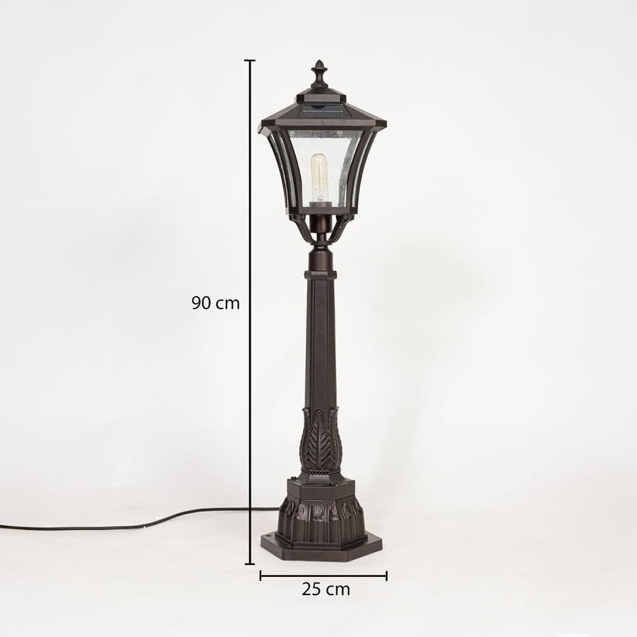 Classic outdoor post lamp in black metal with glass shade showing 90 cm height and 25 cm base width for landscape lighting.