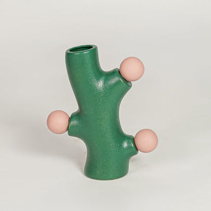 Modern green ceramic flower vase with pink sculpted accents perfect for living room console table shelf or entryway decor styling.