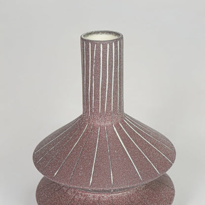 Closeup pink textured ceramic vase surface detail modern decorative flower vase for table shelf console decor.