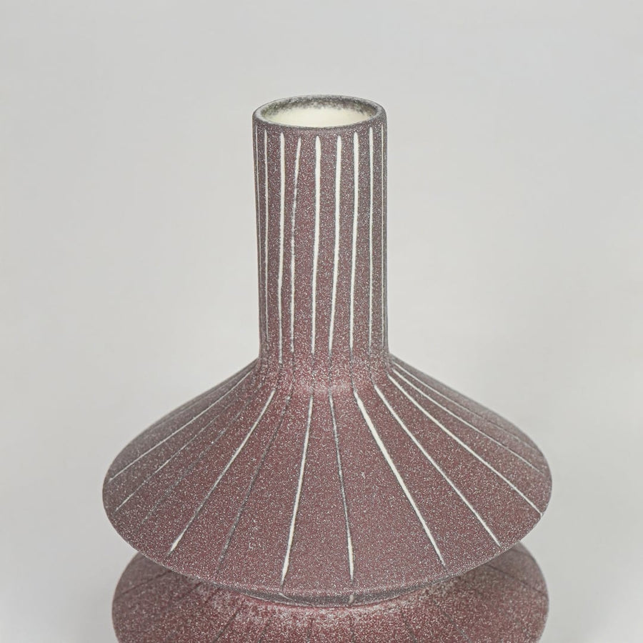 Closeup pink textured ceramic vase surface detail modern decorative flower vase for table shelf console decor.