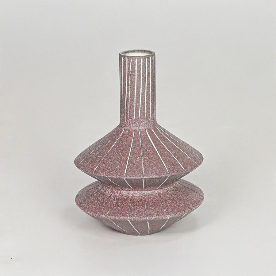 Matte terracotta tiered geometric vase with fine lines for modern home decor and artistic tabletop centerpiece.