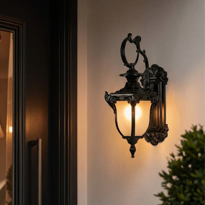 Vintage black outdoor wall light lifestyle image with ornate detailing for elegant exterior entryway decor.