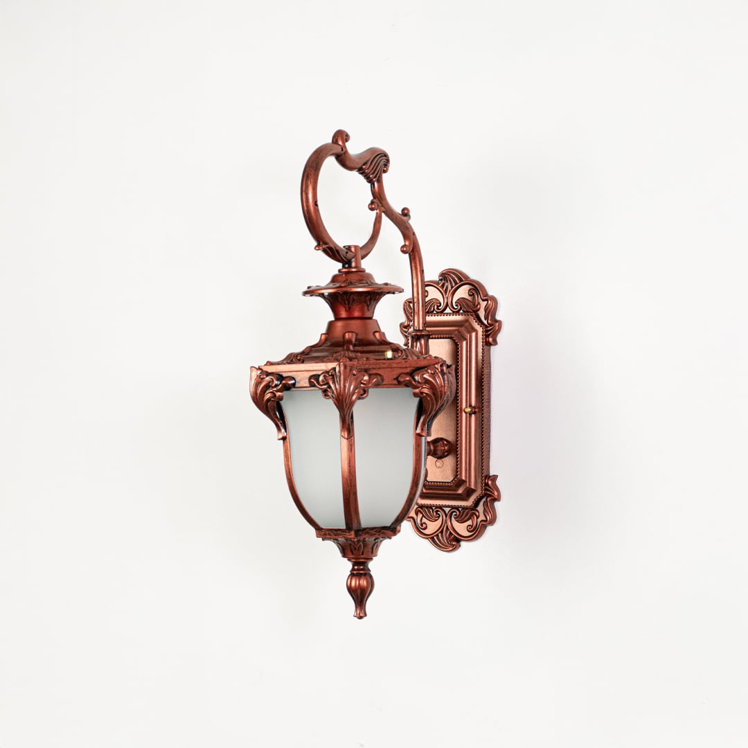 Outdoor wall light with antique bronze finish and frosted glass shade switched off against white background.