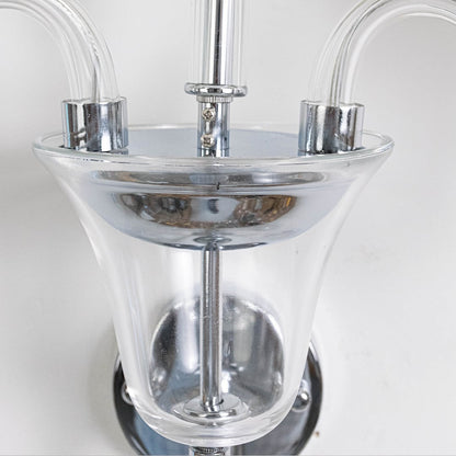 Closeup of triple arm wall light with chrome finish fabric shades and crystal detail for elegant wall decor.