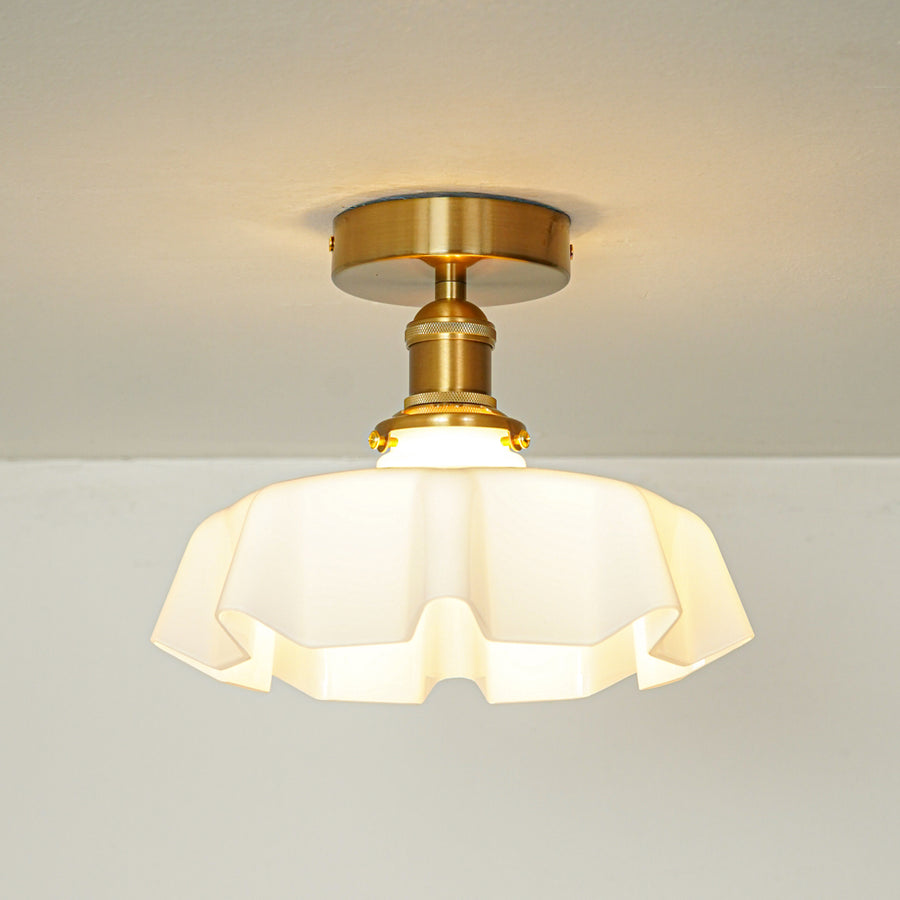Modern cream glass and gold metal ceiling light for stylish hallway and vintage inspired decor styling spaces.
