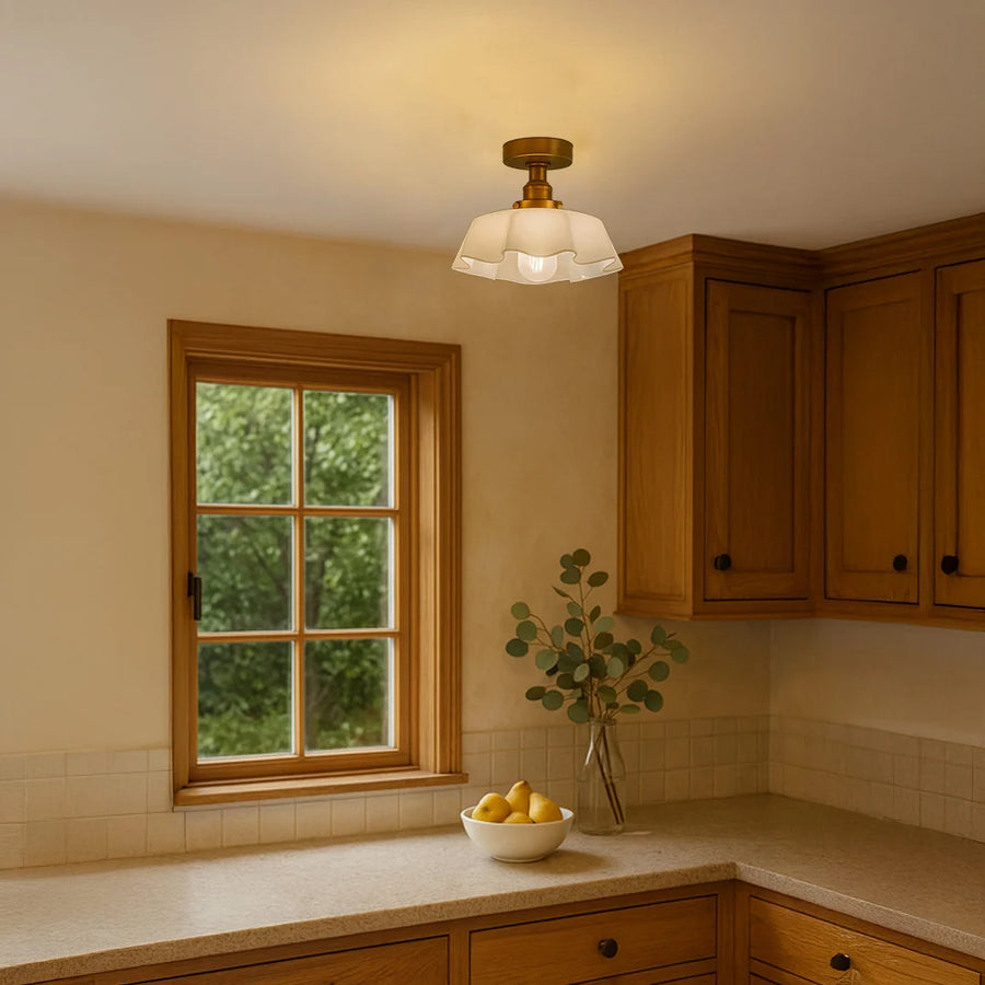 Elegant cream glass ceiling light in kitchen setting for warm ambient lighting and traditional home decor spaces.