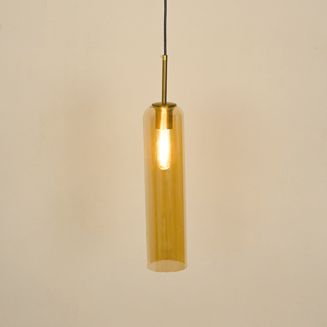 Amber glass pendant light illuminated with warm glow for stylish dining room ceiling decor.